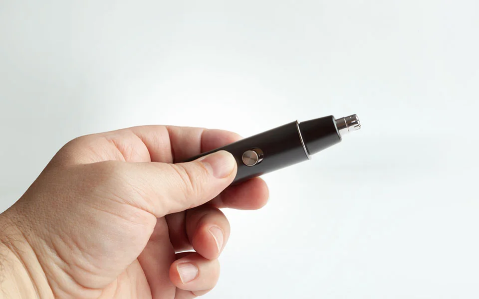Man holding nose hair trimmer