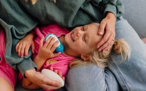 GIrl holding Moonbuddy device